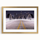 Extra large abstract art print of Los Angeles skyline in muted gold and gray tones on framed canvas.