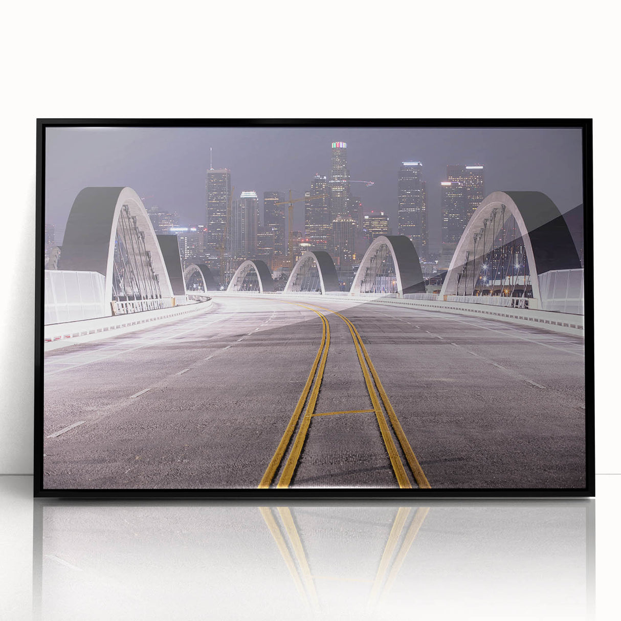 Large abstract wall art depicting the Los Angeles skyline in muted gray and blue tones on a framed acrylic print.
