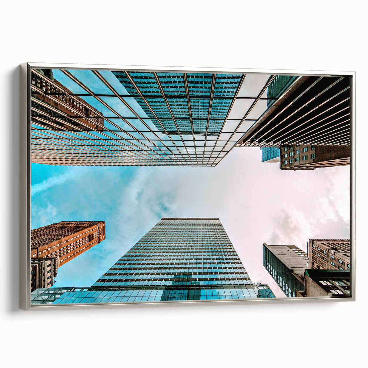 Framed canvas of San Francisco landscape art painting in silver, featuring vintage poster-style black and colorful elements.