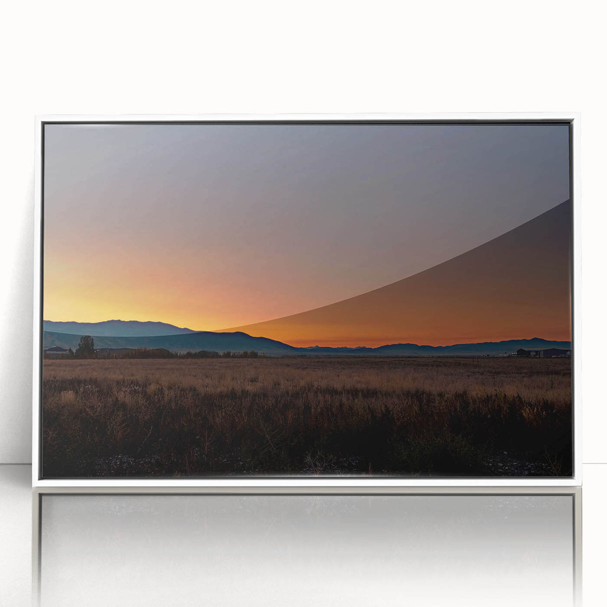 Acrylic print of a serene Montana landscape in muted earth tones, framed in white.