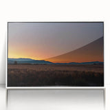 Acrylic print of a serene Montana landscape in muted earth tones, framed in white.