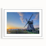 Abstract art print of Charlotte skyline in muted gray and blue tones on a framed white mat, ideal for dining room decor.