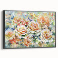 Framed canvas artwork displaying vibrant abstract floral designs in shades of pink, blue, and green, with a sleek black frame, ideal for modern home decor.