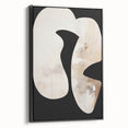 Framed minimalist wall art featuring an abstract design in black tones, showcasing a sleek side view that highlights its modern aesthetic and elegant framing. Ideal for contemporary home decor.