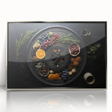 Mid-century modernist art depicting assorted fruits in vibrant colors on a silver-framed acrylic print.