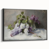 Framed canvas artwork showcasing an abstract floral design in vibrant colors, displayed in a sleek black frame from a side view, perfect for modern decor.