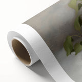 Abstract floral design on rolled canvas featuring vibrant colors and intricate patterns, packaged securely in a cardboard tube for safe delivery and display.