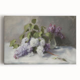 Abstract floral stretched canvas artwork showcasing vibrant colors of pink, blue, and yellow flowers against a soft white background, perfect for modern home decor.