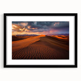 Framed landscape artwork depicting serene sand dunes in a black frame with a mat, showcasing earthy tones and soft textures, ideal for modern home decor.