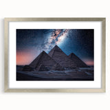 Abstract art print of Egyptian scenery in muted earth tones on a framed canvas, suitable for dining room decor.
