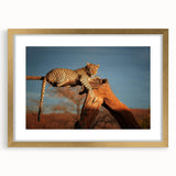 Textured abstract art print of Namibian scenery in muted earth tones, framed in gold, ideal for bedroom art.