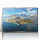 Large art print of an African savannah scene in muted earth tones on silver-framed acrylic.