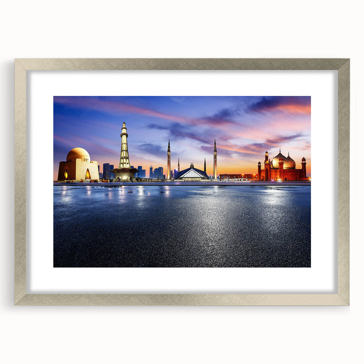 Textured art print of abstract scenery in muted earth tones, framed in silver, ideal for bedroom ambiance.