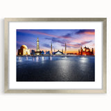 Textured art print of abstract scenery in muted earth tones, framed in silver, ideal for bedroom ambiance.