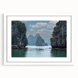 Abstract art print of a Vietnamese landscape in muted greens and blues on a framed white canvas.