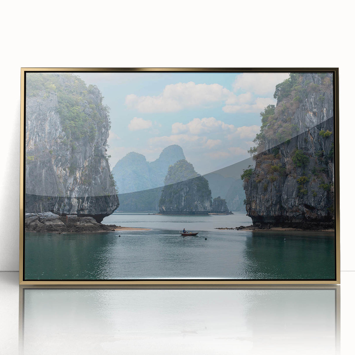 Large art print of a Vietnamese landscape in muted greens and browns, framed in gold acrylic.