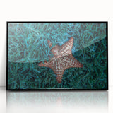 Large abstract wall art depicting a Caribbean scenery in vibrant blue and green, framed in black acrylic.
