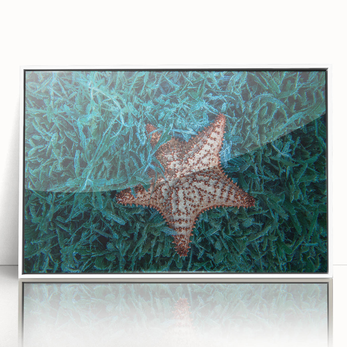 Mid-century modernist art depicting a Caribbean scenery in muted blue and green hues, framed acrylic.