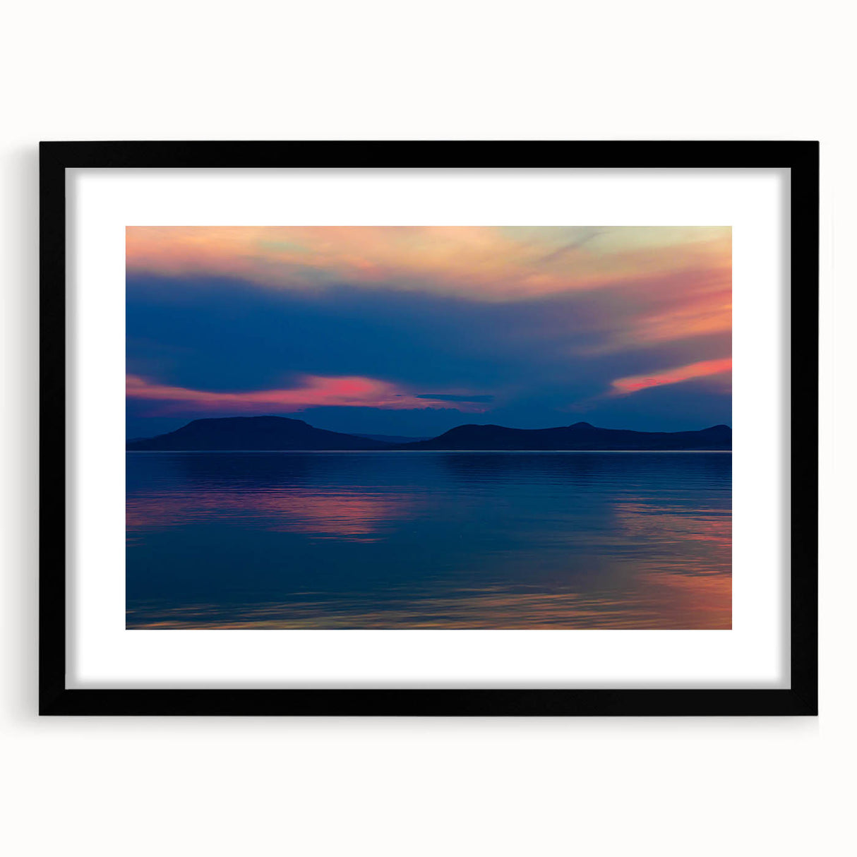 Extra large abstract art print featuring a colorful, textured depiction of a European scenery, framed in black.