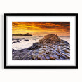 Abstract art print of a vibrant, colorful Irish landscape on a large textured canvas, framed in black.