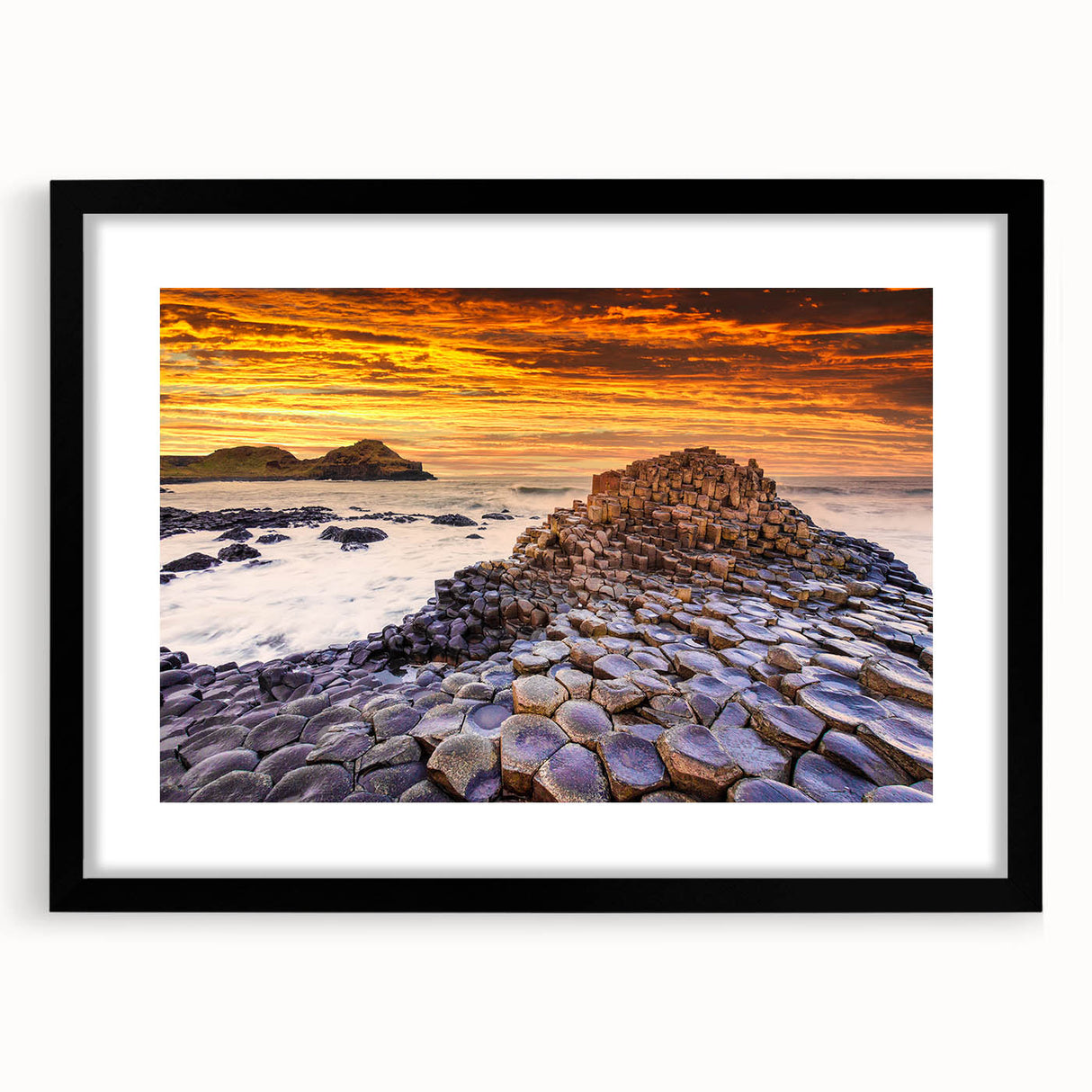Abstract art print of a vibrant, colorful Irish landscape on a large textured canvas, framed in black.