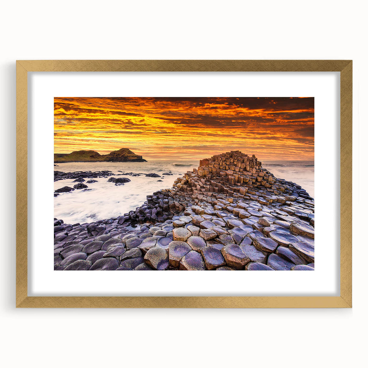 Abstract art print of a European scenery in Ireland with muted green and blue tones, framed in gold.