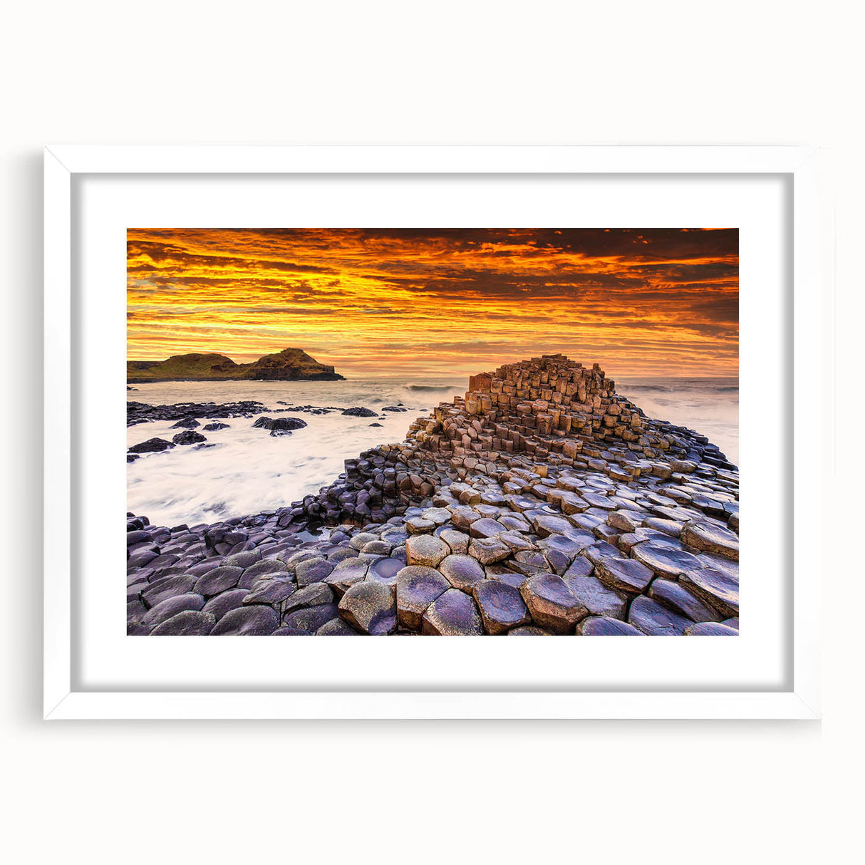 Textured abstract art print of a serene Irish landscape in muted green and blue tones, framed with a white mat.