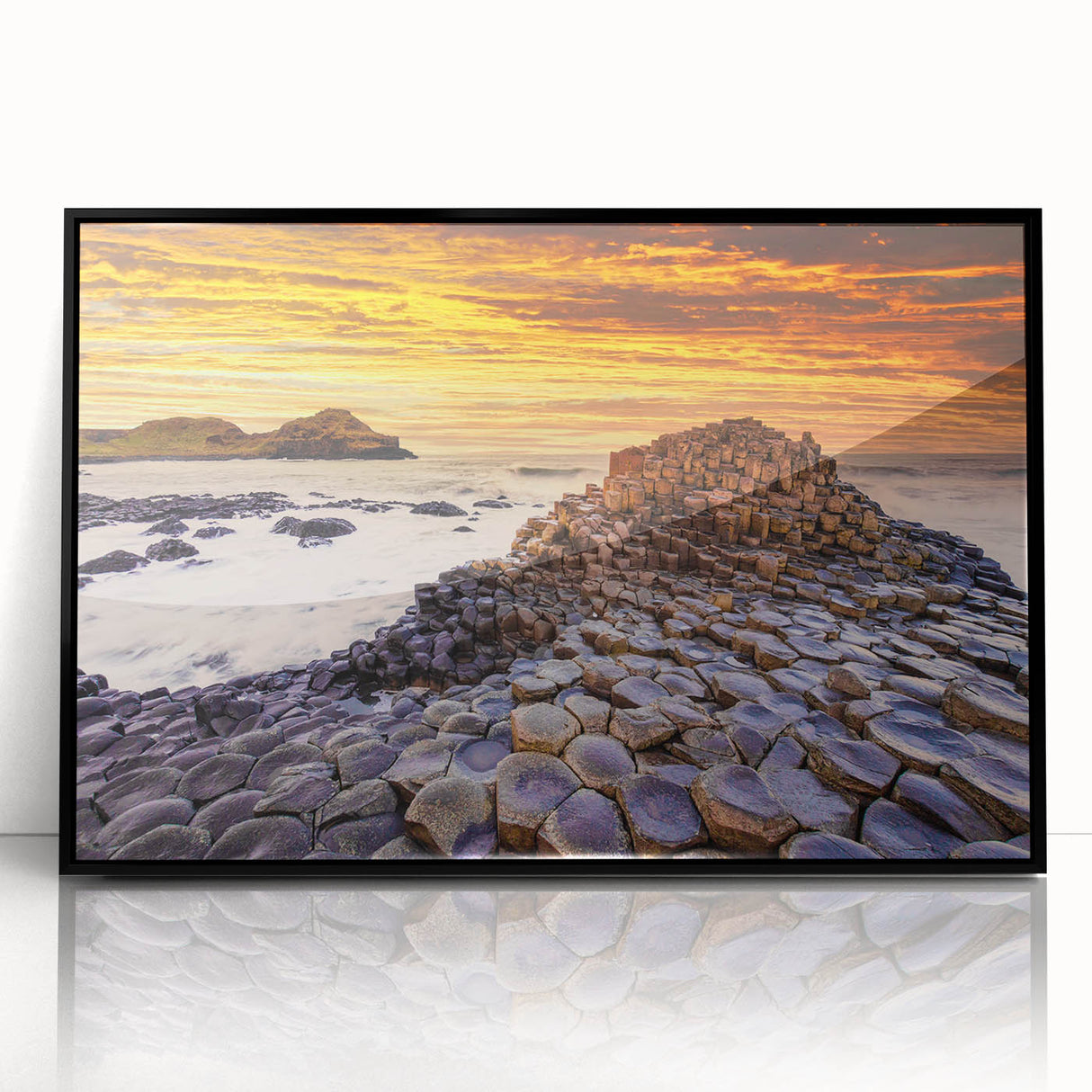 Large abstract wall art featuring a scenic Irish landscape in muted green and blue tones, framed in black acrylic.