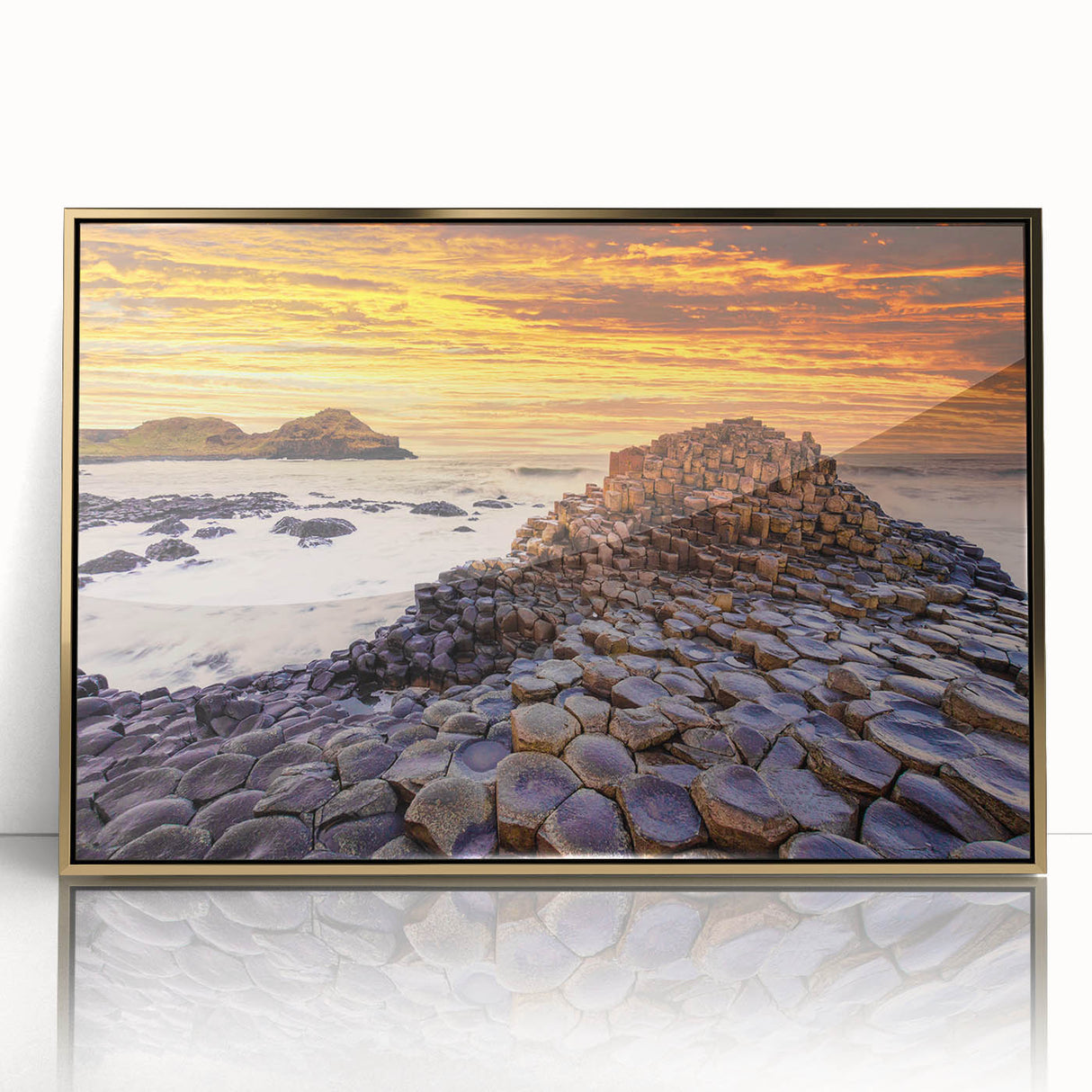 Art deco poster of an Irish landscape in muted green and gold tones, acrylic print framed in gold.