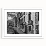 Textured art print of an abstract Venice scenery in muted earth tones on a framed white mat, suitable for bedroom decor.