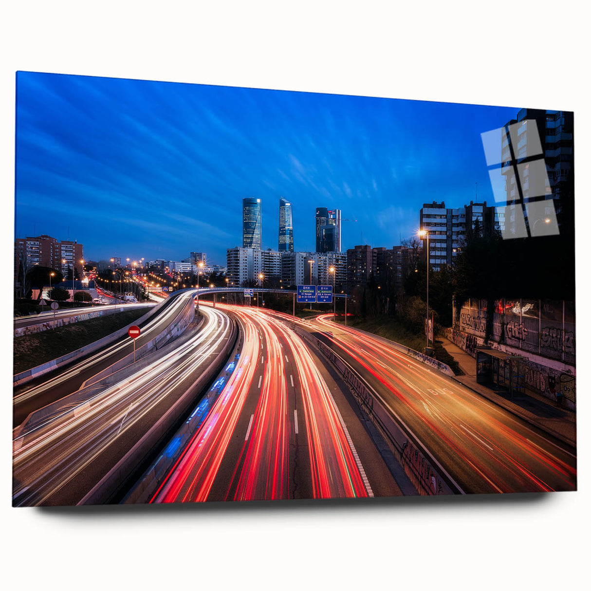 Large abstract wall art of Madrid's scenery in vibrant colors on acrylic glass, ideal for bedroom or dining room decor.