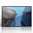 Large abstract wall art depicting Stockholm's skyline in muted gray and blue tones on a framed acrylic print.