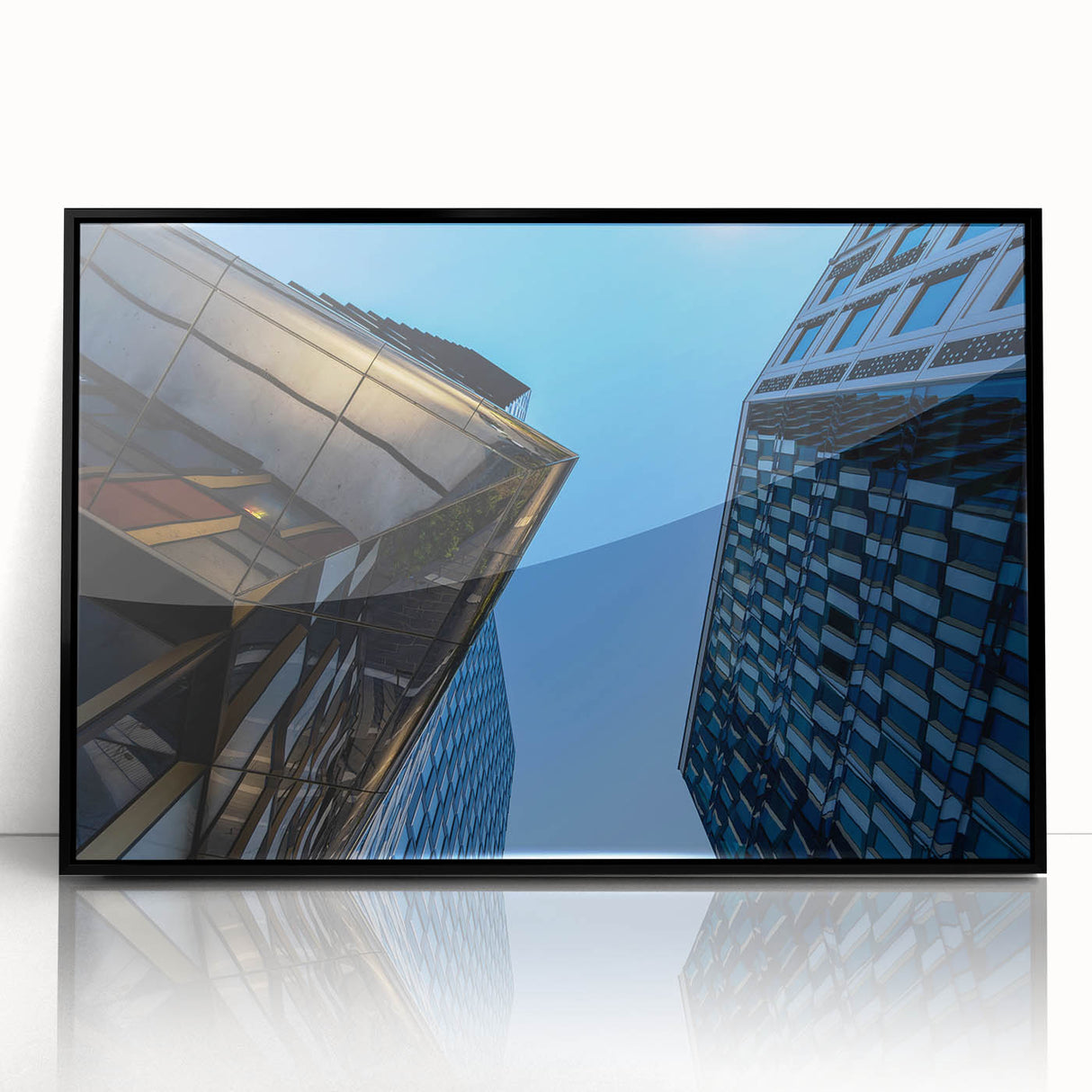 Large abstract wall art depicting Stockholm's skyline in muted gray and blue tones on a framed acrylic print.