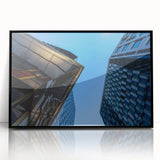 Large abstract wall art depicting Stockholm's skyline in muted gray and blue tones on a framed acrylic print.