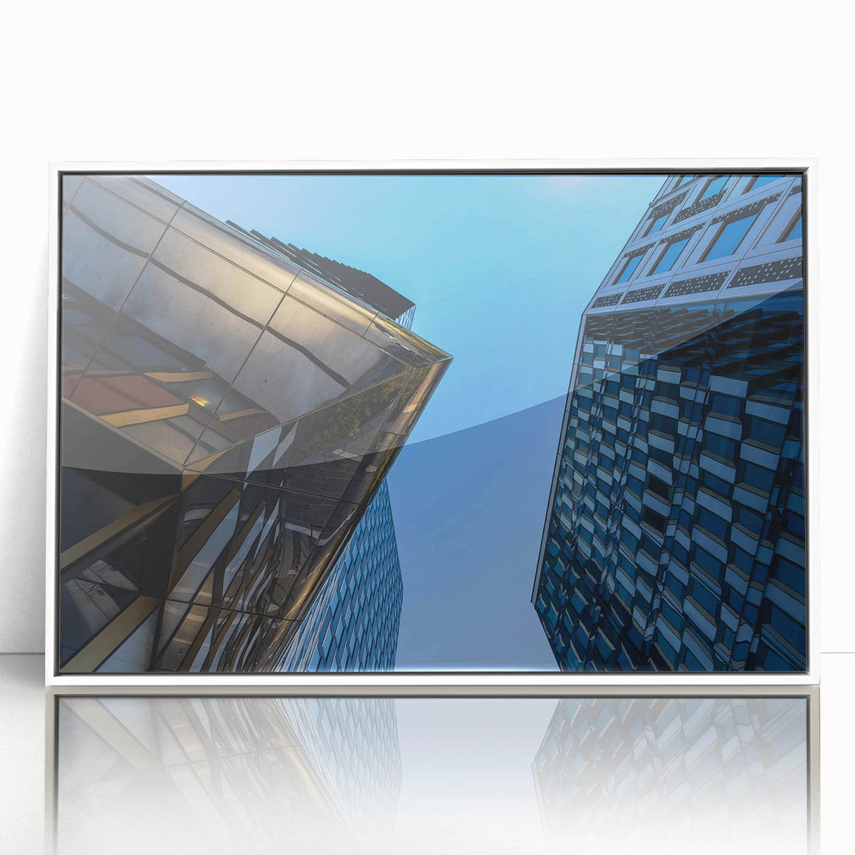 Art deco poster of Stockholm skyline in muted gray and blue tones on a white acrylic framed print.