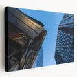 Large art depicting Stockholm scenery in muted blue and orange tones on stretched canvas, suitable for kitchen wall art.