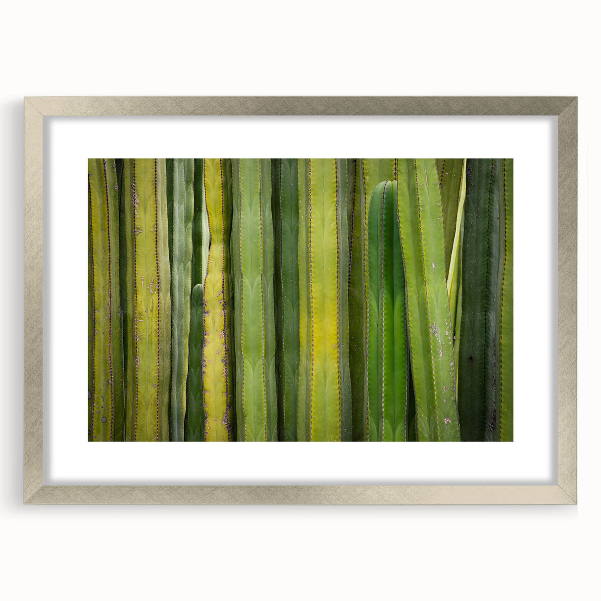 Textured abstract art print depicting a muted color palette, framed in silver, suitable for bedroom decor.