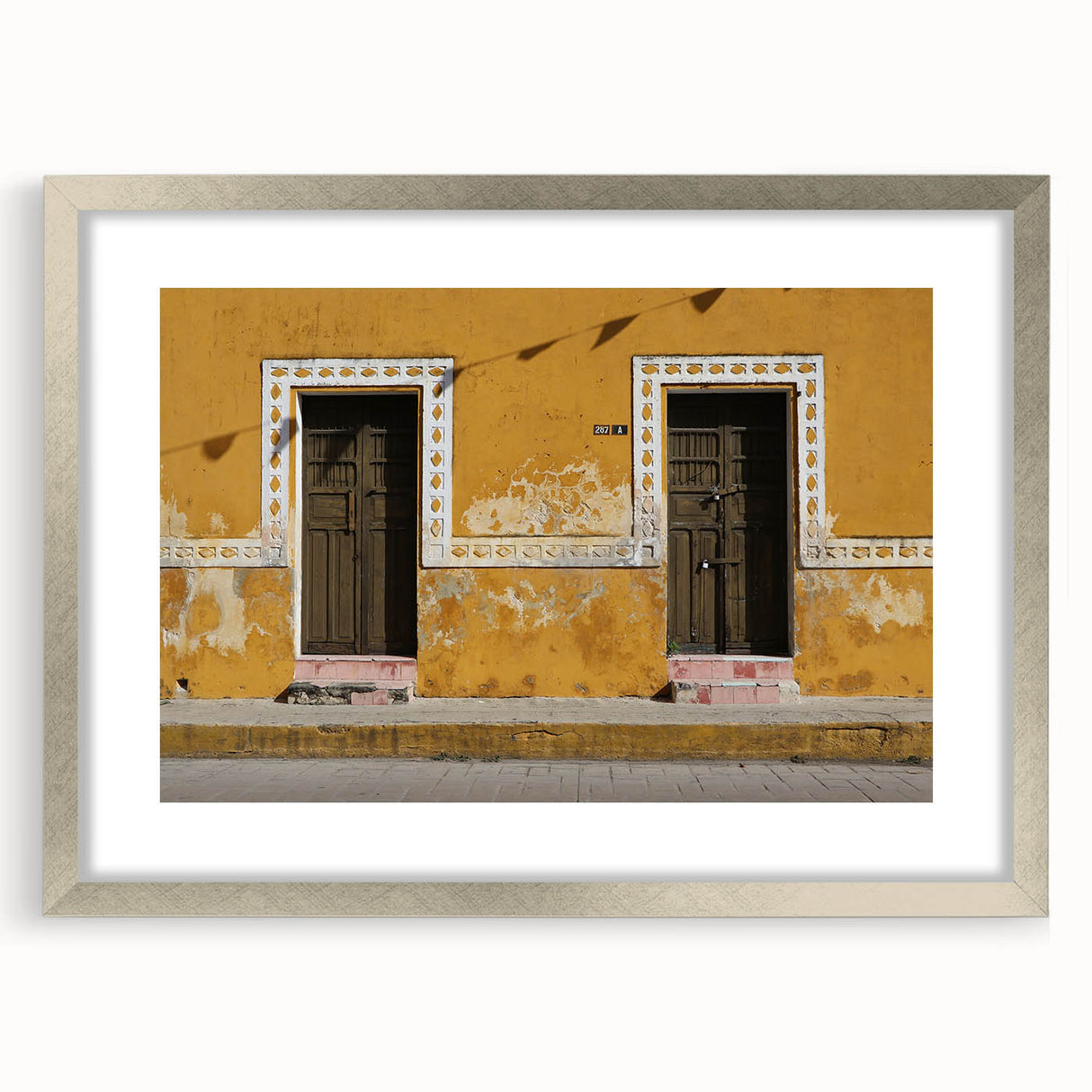 Textured art print of abstract scenery in Quintana Roo, Mexico, featuring earthy tones on a framed silver mat.