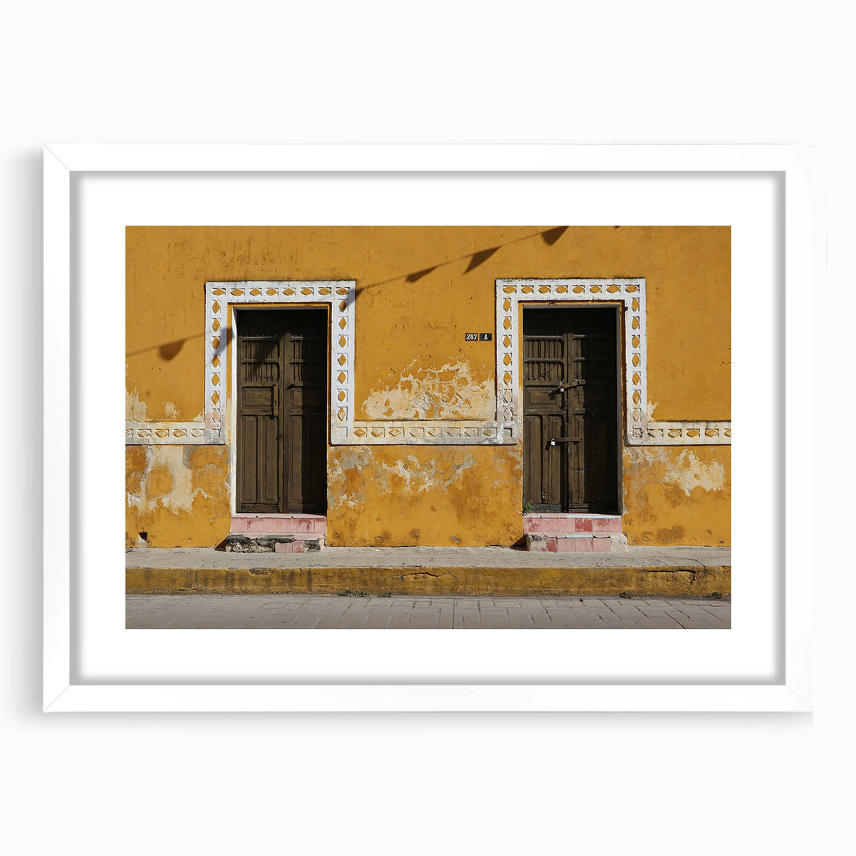 Abstract art print of Quintana Roo scenery in muted blue and green tones on a white framed canvas.