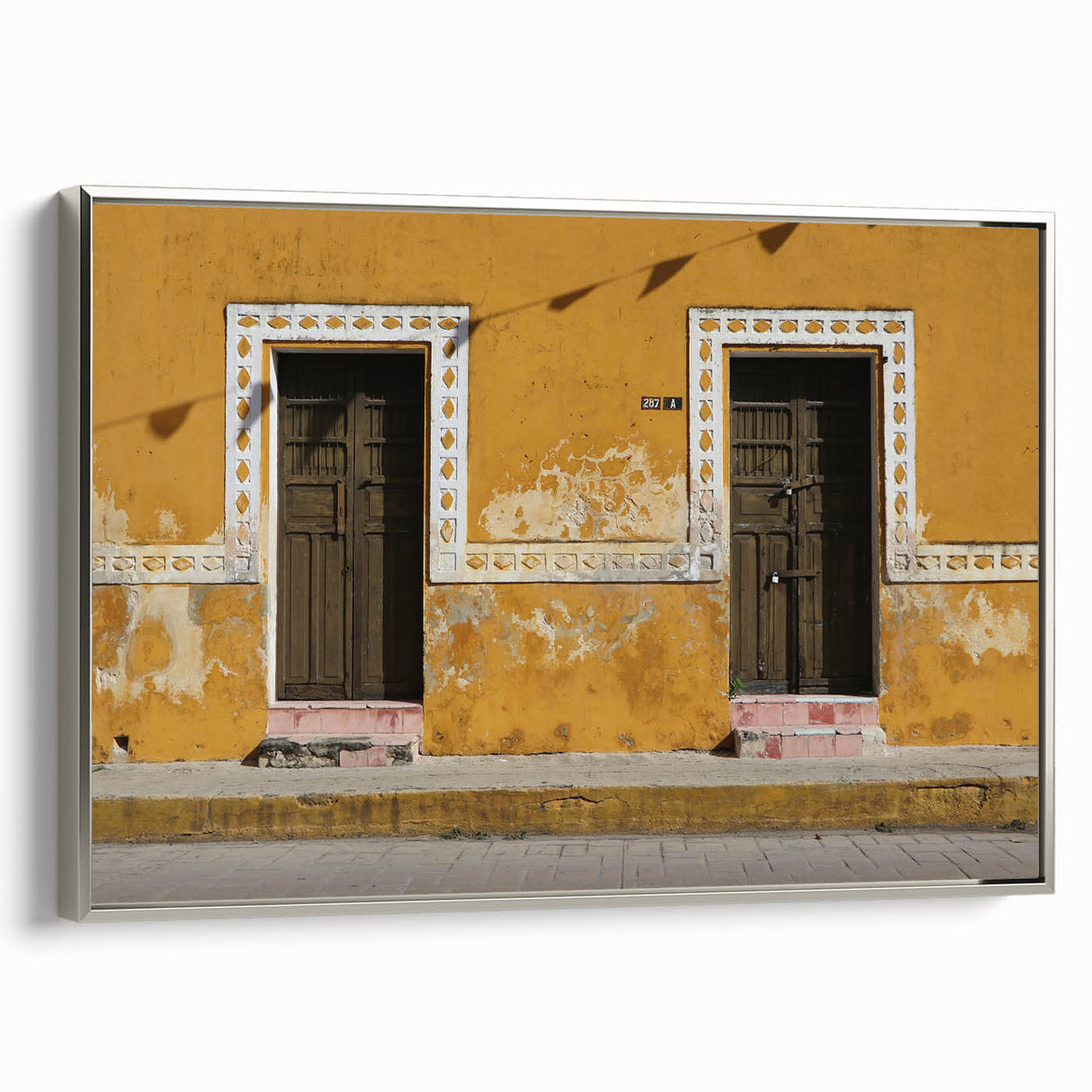 Framed canvas featuring a vintage-style landscape painting of Quintana Roo, Mexico with vivid colors and black accents.