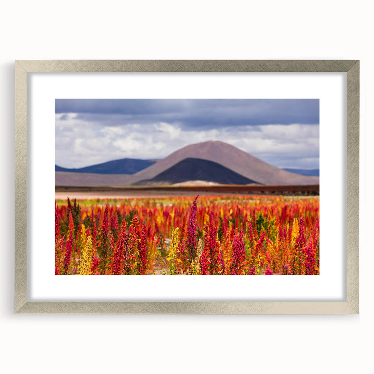 Textured abstract art print of a Bolivian landscape in muted earth tones, framed in silver, suitable for bedroom decor.