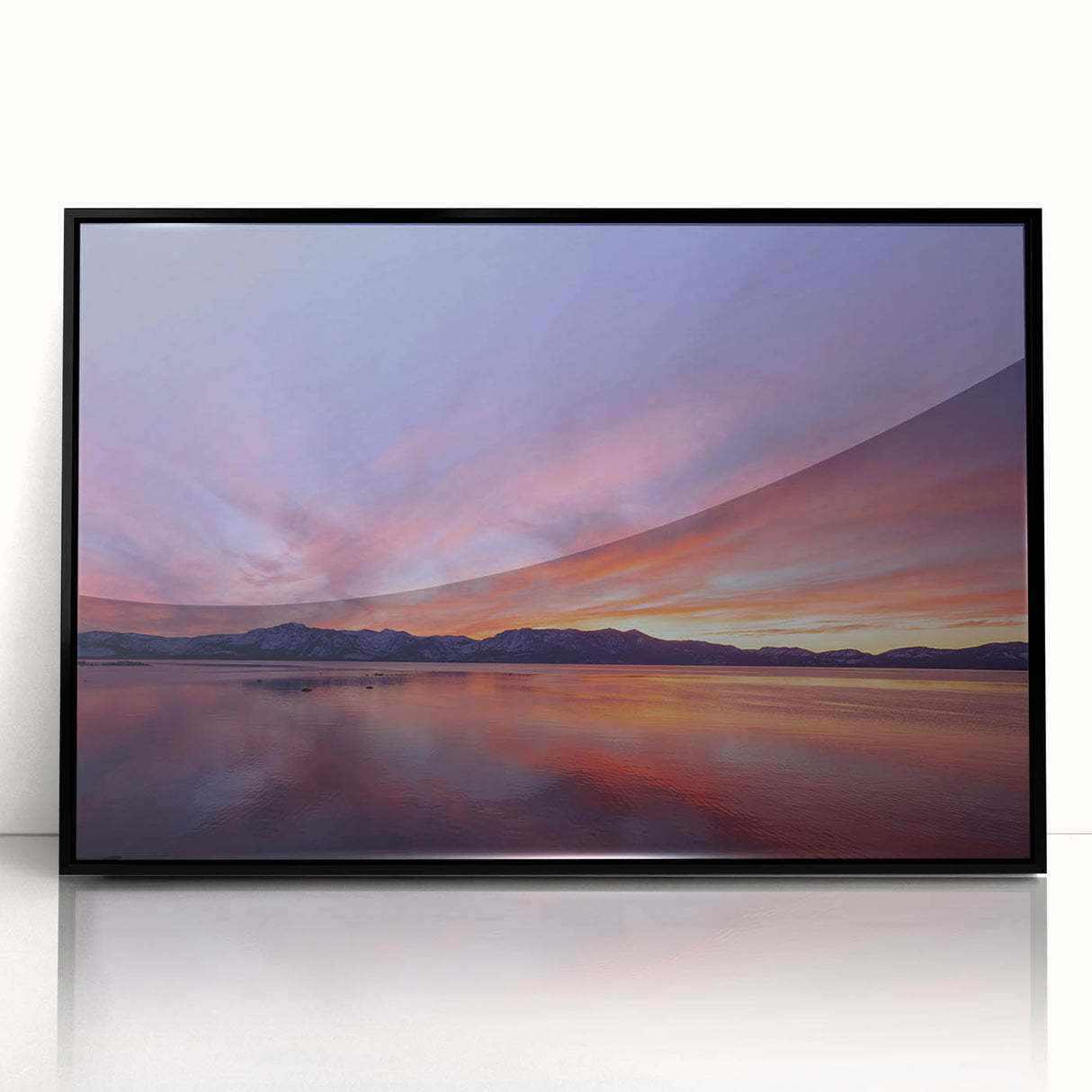 Large abstract wall art depicting Lake Tahoe in muted blue and green tones, framed in black acrylic.