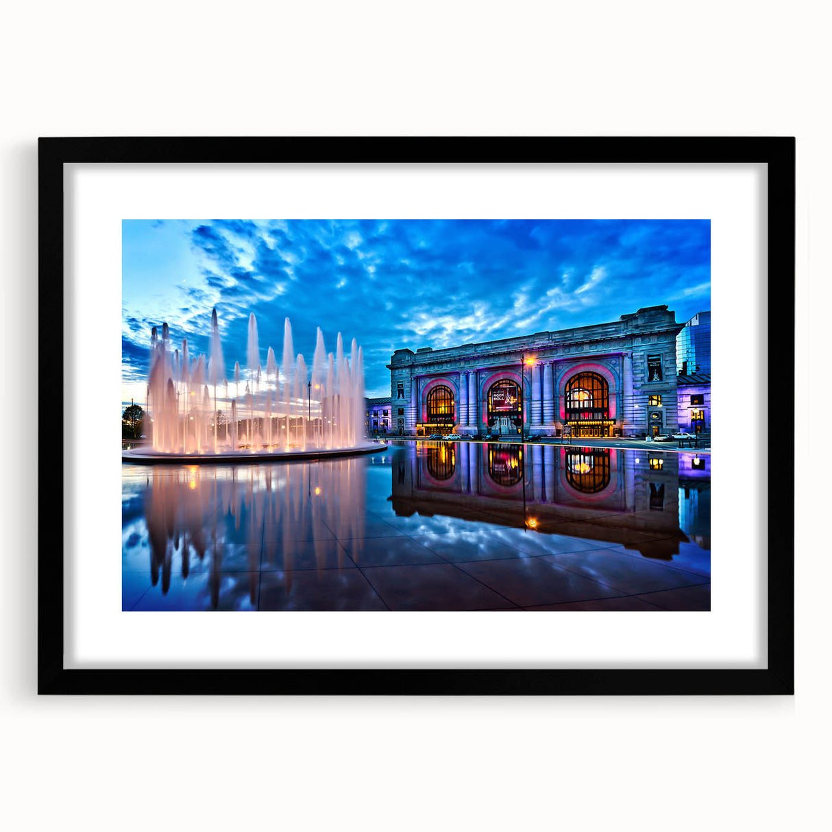 Abstract art print featuring textured, colorful swirls of blue, orange, and white, framed in black.