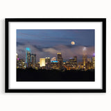 Extra large framed wall art of an abstract Charlotte skyline in colorful textured tones, ideal for living room decor.