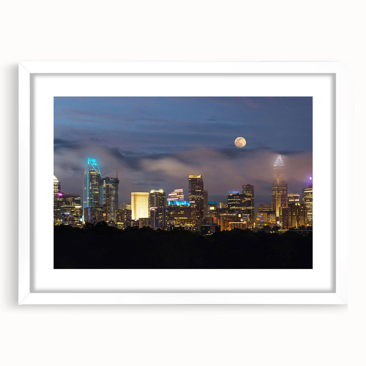Abstract art print of Charlotte skyline in muted gray and blue tones on a framed white mat, suitable for dining room decor.