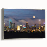 Landscape art painting of Charlotte, North Carolina skyline in colorful hues on a framed silver canvas.