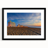 Abstract art print featuring vibrant, textured colors on a black framed canvas, ideal for living room decor.