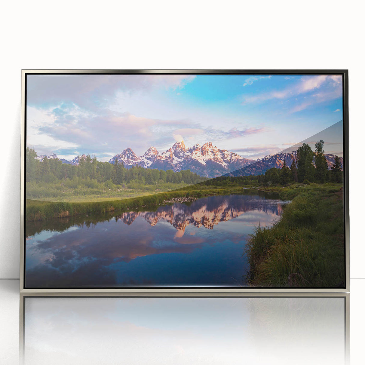 Mid-century modernist art depicting the Grand Tetons in muted earth tones on a silver-framed acrylic.