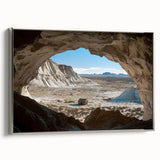 Framed canvas artwork depicting a serene landscape with caves, featuring a silver frame that enhances the visual appeal, ideal for modern home decor.