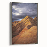 Framed canvas artwork showcasing a serene desert landscape with soft, muted colors and silver frame, ideal for enhancing modern home decor aesthetics.